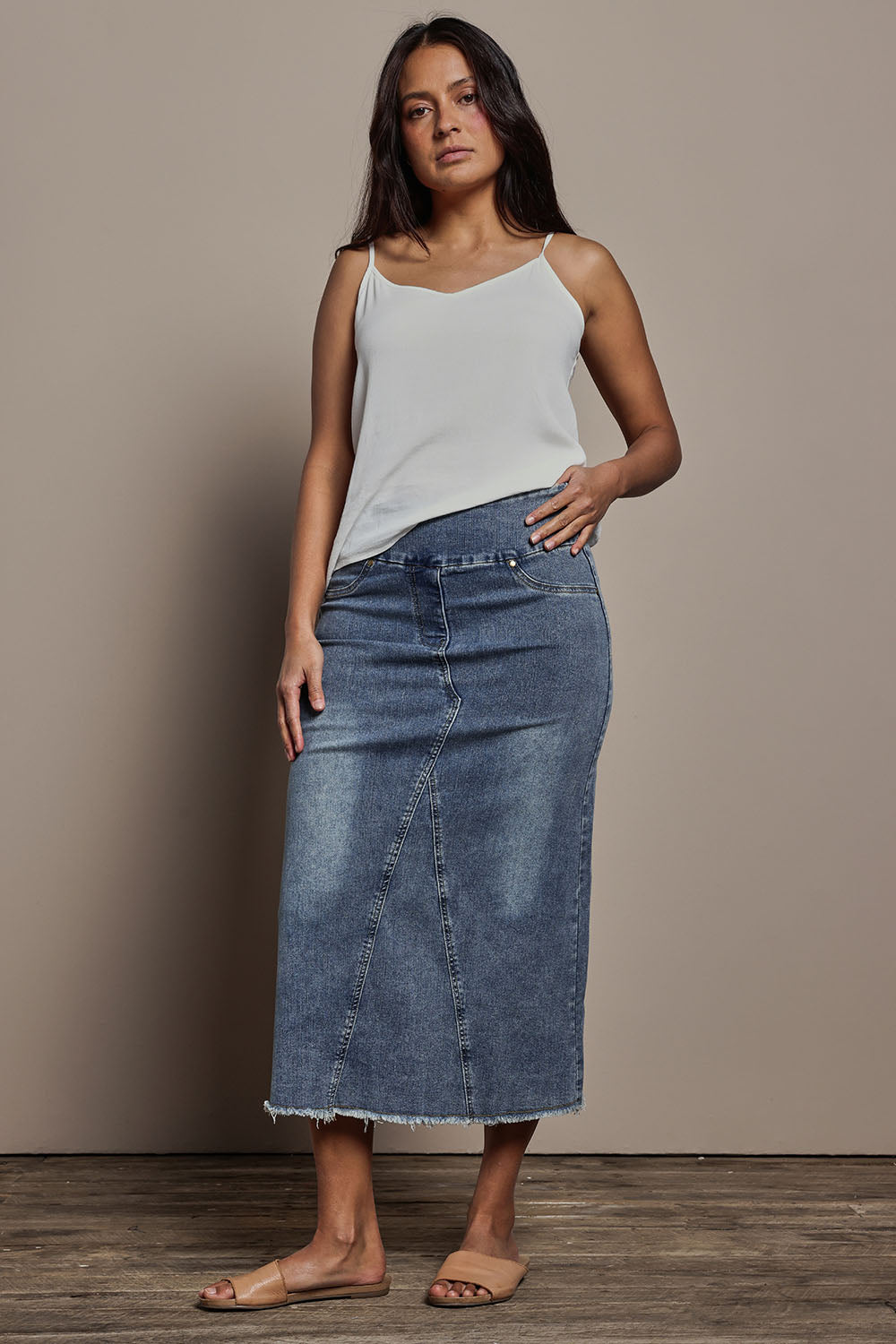Model Tahnee wearing size 10 of the Easy As Pull On Denim Skirt in colour Denim (Blue), from the front, showing the whole outfit