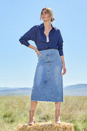 Model Tegan wearing size 10 of the Easy As Pull On Denim Skirt in colour Denim (Blue), from the front, showing the whole outfit