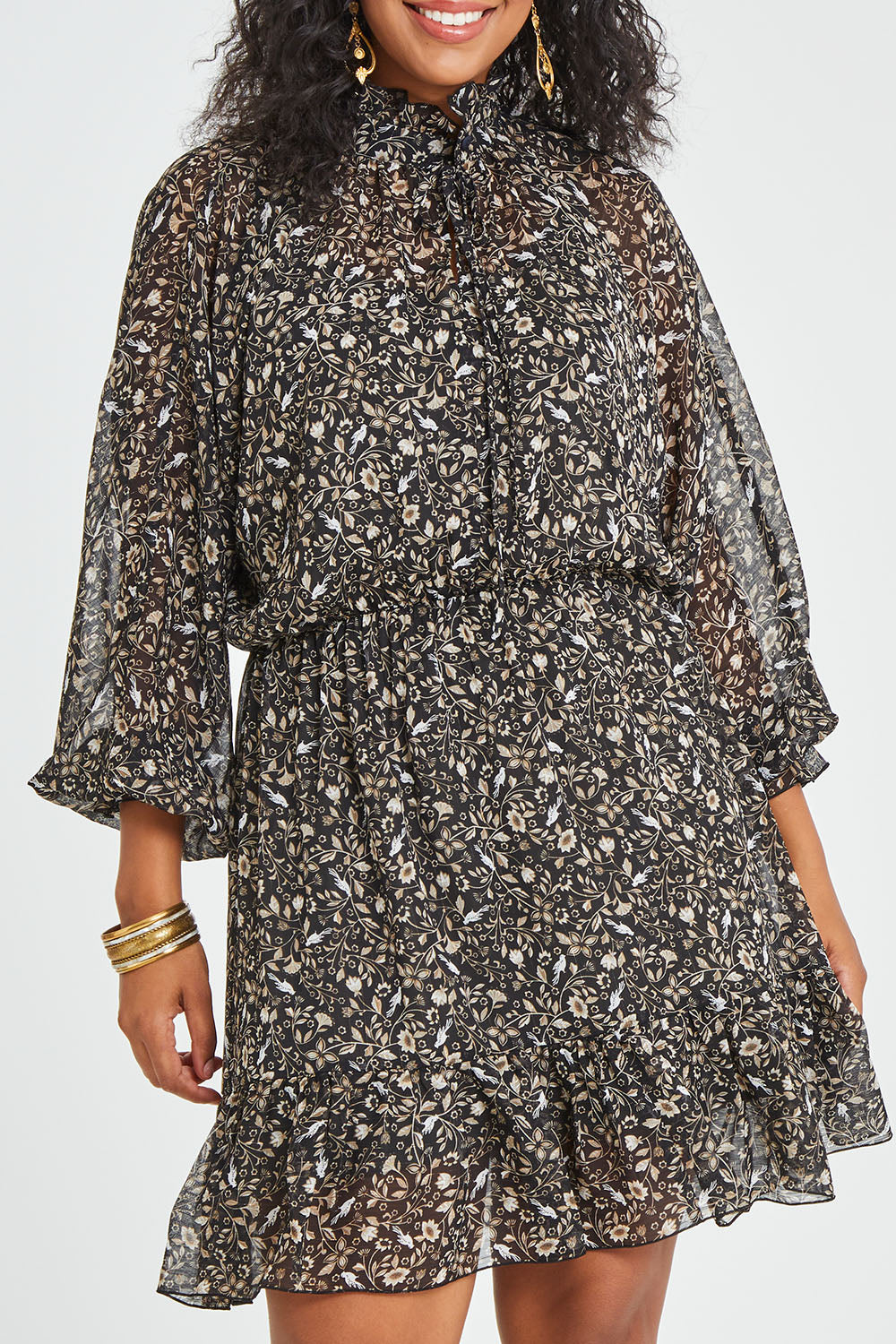 Model Noli wearing size 14 of the You Light Up The Room Dress in colour Blackbird (Black), from the front, cropped image