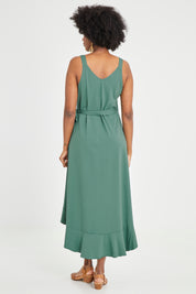 Model Aiyana wearing size 10 of the Thats A Wrap Mercerised Cotton Dress in colour Fern (Green), from the back