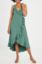 Model Aiyana wearing size 10 of the Thats A Wrap Mercerised Cotton Dress in colour Fern (Green), from the front, cropped image