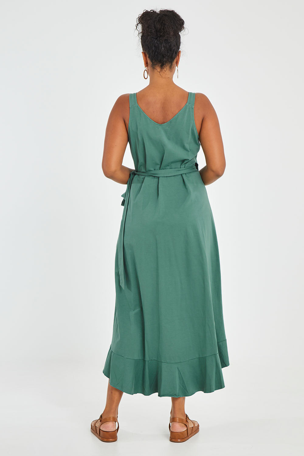 Model Noli wearing size 14 of the Thats A Wrap Mercerised Cotton Dress in colour Fern (Green), from the back