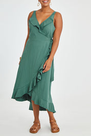 Model Noli wearing size 14 of the Thats A Wrap Mercerised Cotton Dress in colour Fern (Green), from the front, cropped image