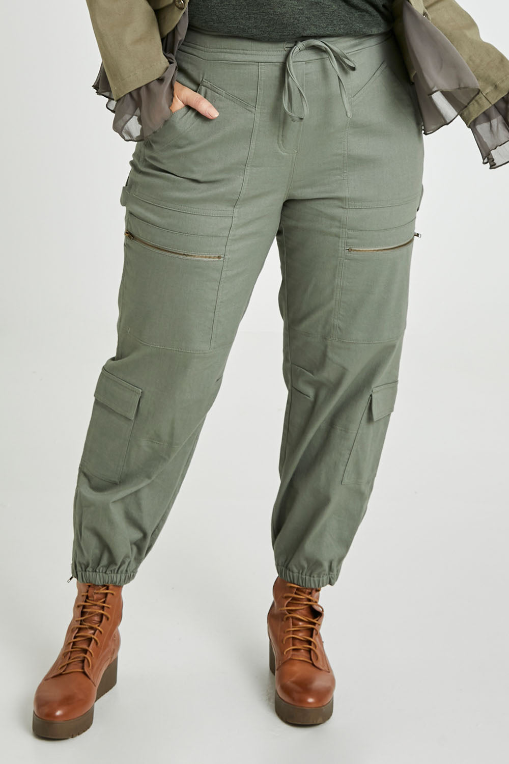 Model Laura wearing size 14 of the I Can Do It Myself Carpenter Cargos in colour Khaki (Green), from the front, cropped image