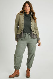 Model Laura wearing size 14 of the I Can Do It Myself Carpenter Cargos in colour Khaki (Green), from the front, showing the whole outfit