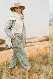 Model Tegan wearing size 10 of the I Can Do It Myself Carpenter Cargos in colour Khaki (Green), from the front, showing the whole outfit