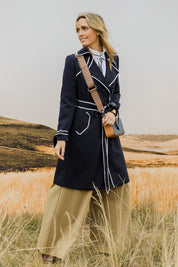 Model Tegan wearing size 10 of the Forever In Style Trench Coat in colour Navy (Blue), from the front, showing the whole outfit