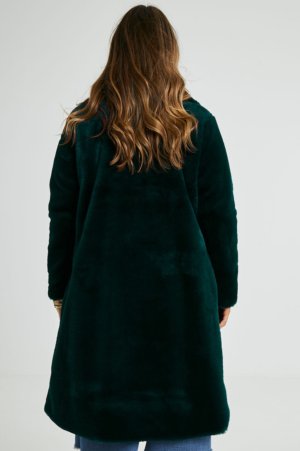 Model Laura wearing size 14 of the Adore You Faux Fur Coat in colour Lagoon (Green), from the back
