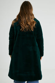 Model Laura wearing size 14 of the Adore You Faux Fur Coat in colour Lagoon (Green), from the back