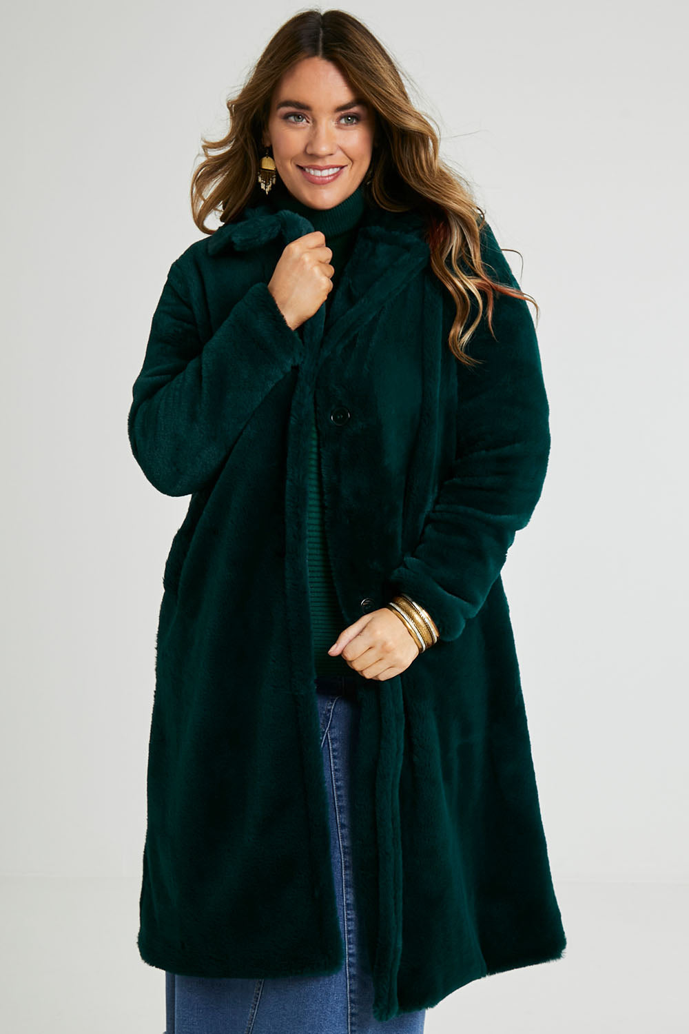 Model Laura wearing size 14 of the Adore You Faux Fur Coat in colour Lagoon (Green), from the front, cropped image