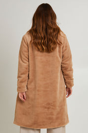 Model Laura wearing size 14 of the Adore You Faux Fur Coat in colour Natural, from the back