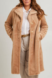 Model Laura wearing size 14 of the Adore You Faux Fur Coat in colour Natural, from the front, cropped image