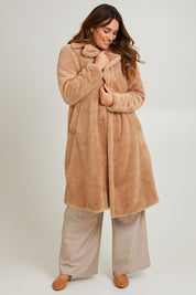 Model Laura wearing size 14 of the Adore You Faux Fur Coat in colour Natural, from the front, showing the whole outfit