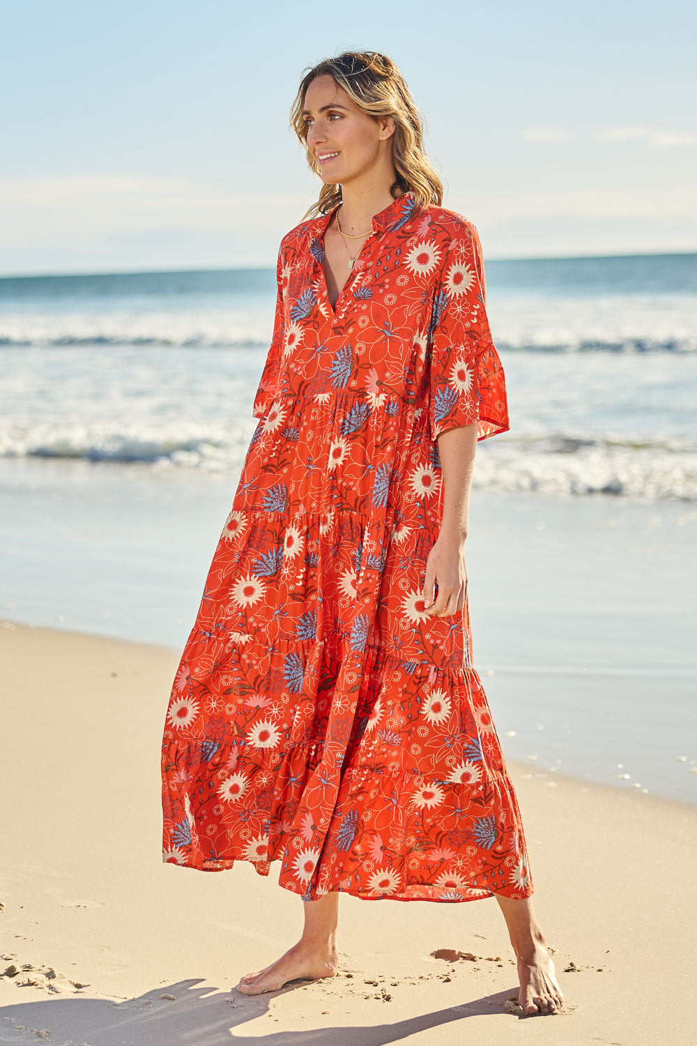 Model Tegan wearing size 10 of the Its Easy Loving You Short Sleeve Dress in colour Redfleur (Red), from the front, showing the whole outfit