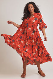 Model Terri-Leigh wearing size 14 of the Its Easy Loving You Short Sleeve Dress in colour Redfleur (Red), from the front, showing the whole outfit