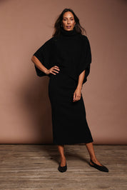 Model Amanda wearing size S of the Knit Pick Pull On Skirt in colour Black (Black), from the front, showing the whole outfit