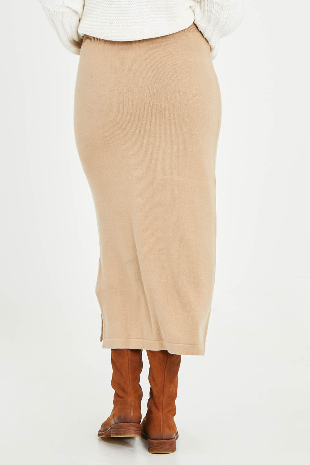 Model Noli wearing size L of the Knit Pick Pull On Skirt in colour Sand, from the back
