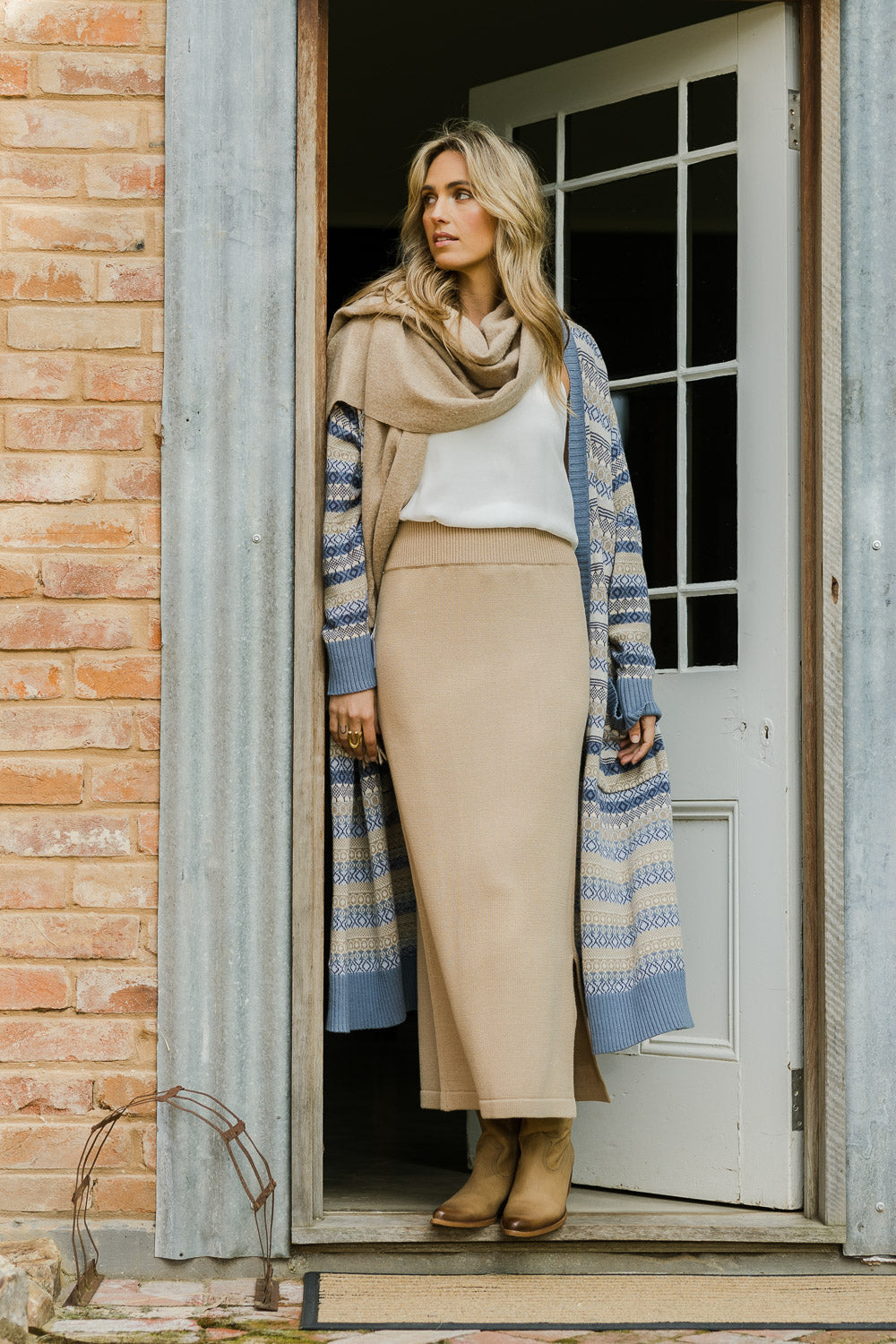Model Tegan wearing size S of the Knit Pick Pull On Skirt in colour Sand, from the front, showing the whole outfit