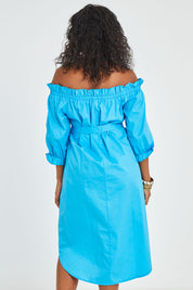 Model Noli wearing size 14 of the Good Vibes Off Shoulder Cotton Dress in colour Bluerad (Blue), from the back