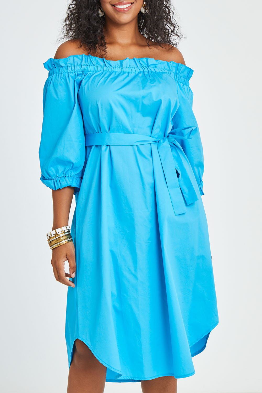 Model Noli wearing size 14 of the Good Vibes Off Shoulder Cotton Dress in colour Bluerad (Blue), from the front, cropped image