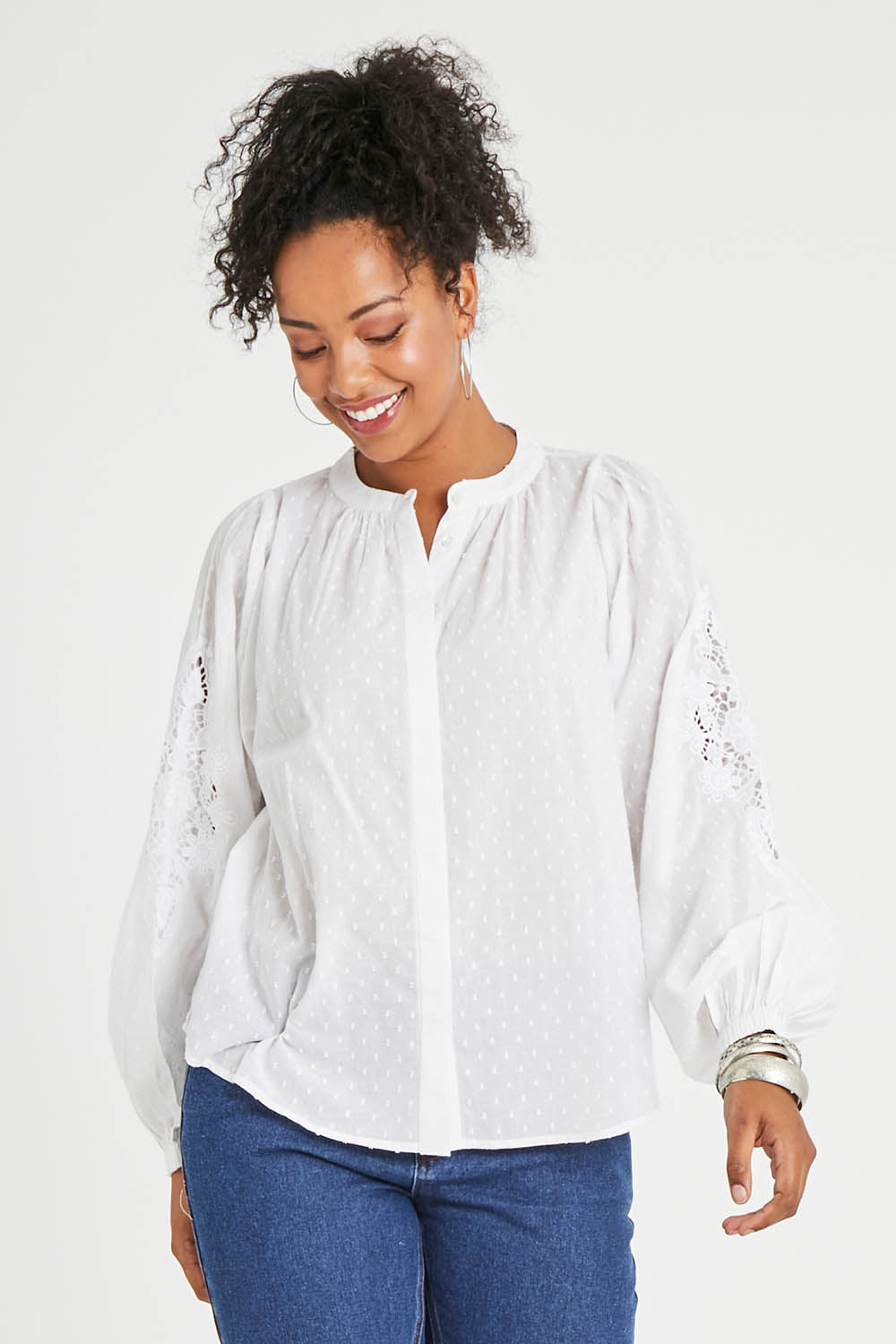Model Noli wearing size 14 of the Lace And Flowers Cotton Blouse in colour Chalk (White), from the front, cropped image