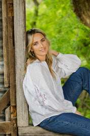 Model Tegan wearing size 10 of the Lace And Flowers Cotton Blouse in colour Chalk (White), from the front, showing the whole outfit