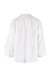 Product shot of the Lace And Flowers Cotton Blouse in colour Chalk (White), from the back