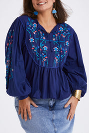 Model Monique wearing size 14 of the My Happiness Embroidered Blouse in colour Navycombo (Blue), from the front, cropped image