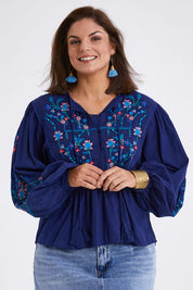 Model Monique wearing size 14 of the My Happiness Embroidered Blouse in colour Navycombo (Blue), from the front, cropped image