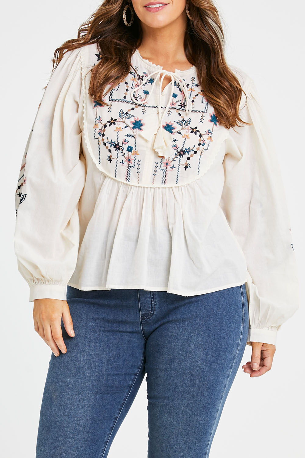 Model Laura wearing size 14 of the My Happiness Embroidered Blouse in colour Sand, from the front, cropped image