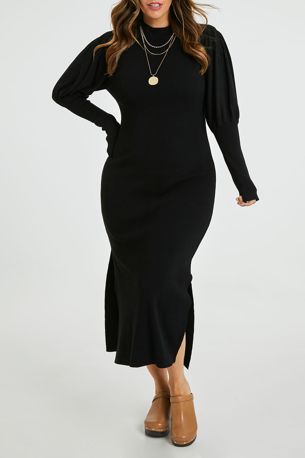 Model Laura wearing size L of the Day Or Night Balloon Sleeve Dress in colour Black (Black), from the front, cropped image