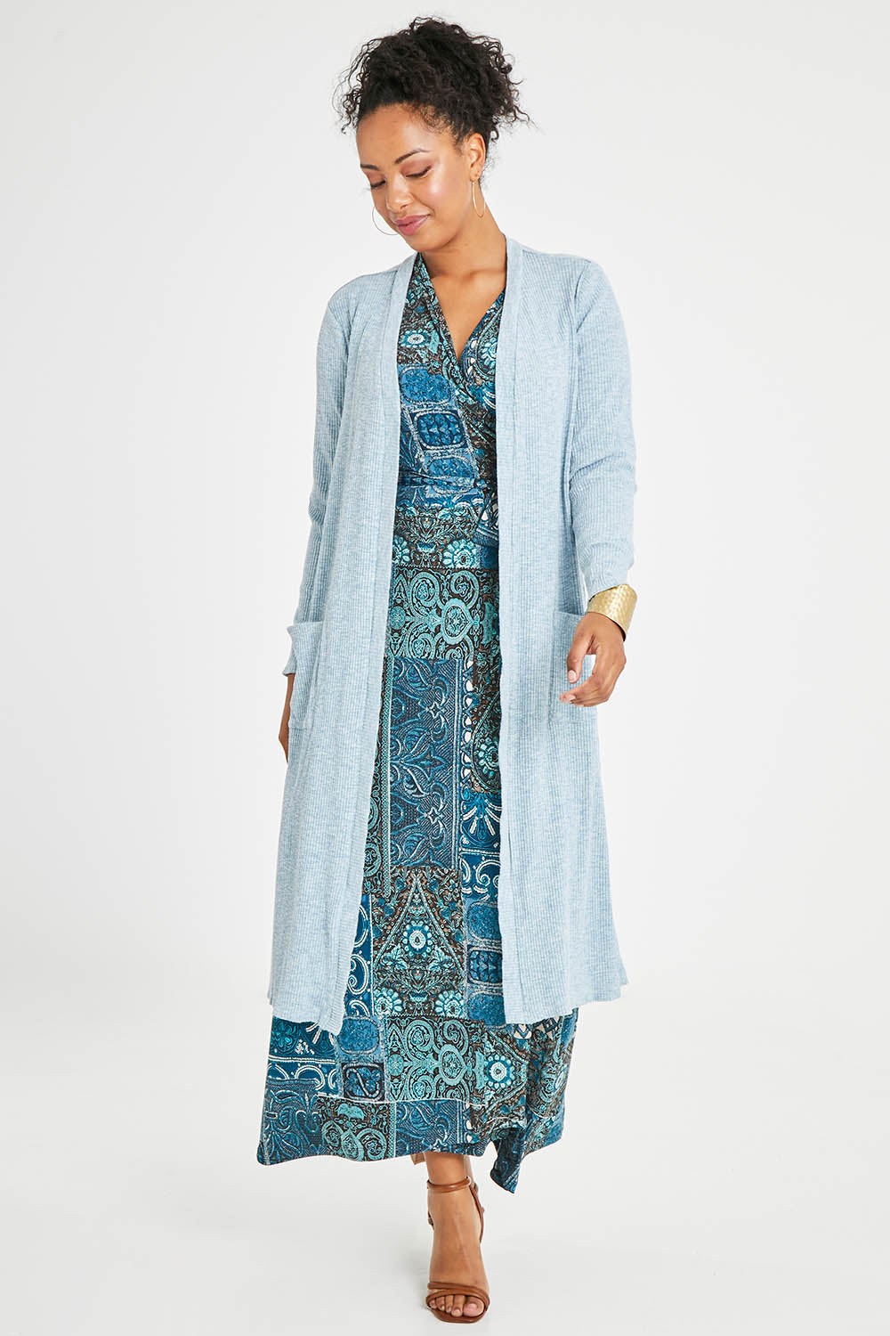Model Noli wearing size 14 of the Sunset Watching Cardi in colour Sky (Blue), from the front, showing the whole outfit