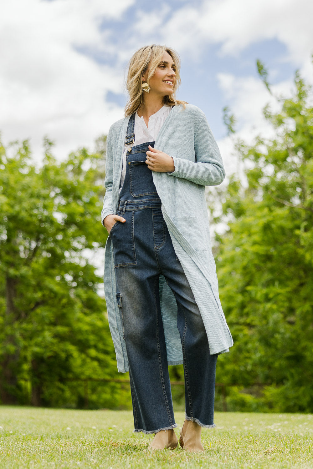 Model Tegan wearing size 10 of the Sunset Watching Cardi in colour Sky (Blue), from the front, showing the whole outfit