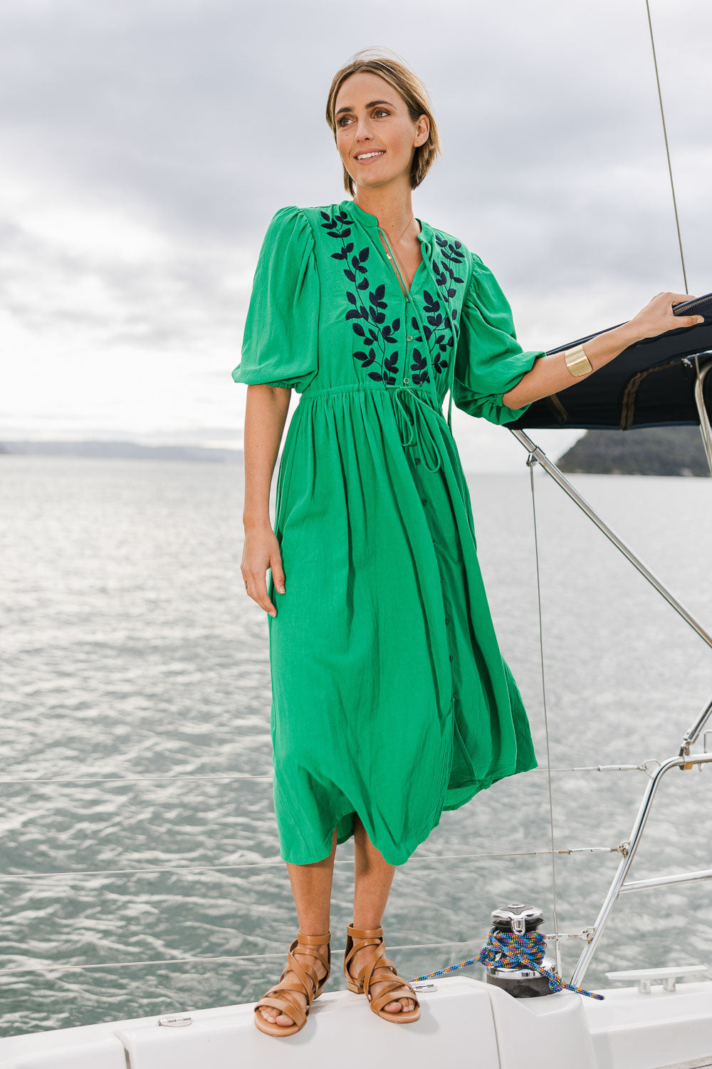 Model Tegan wearing size 10 of the For Love And Dancing Dress in colour Emerald (Green), from the front, showing the whole outfit