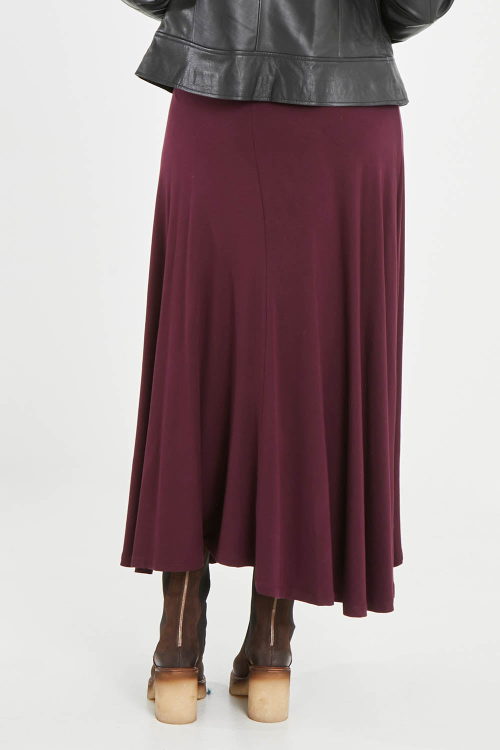 Model Noli wearing size 14 of the Love Language Bamboo Maxi Skirt in colour Merlot (Red), from the back