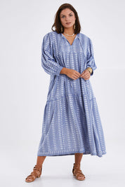 Model Monique wearing size 14 of the Puff Sleeve Delight Dress in colour Bluewhite (Blue), from the front, showing the whole outfit