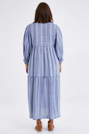 Model Monique wearing the Puff Sleeve Delight Dress in colour Bluewhite (Blue), from the back