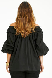 Model Laura wearing size 14 of the Date Night Cotton Ruffle Top in colour Black (Black), from the back