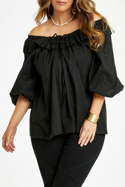 Model Laura wearing size 14 of the Date Night Cotton Ruffle Top in colour Black (Black), from the front, cropped image