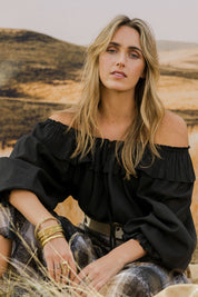 Model Tegan wearing size 10 of the Date Night Cotton Ruffle Top in colour Black (Black), from the front, showing the whole outfit