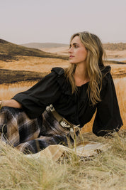 Model Tegan wearing the Date Night Cotton Ruffle Top in colour Black (Black), from the front, showing the whole outfit