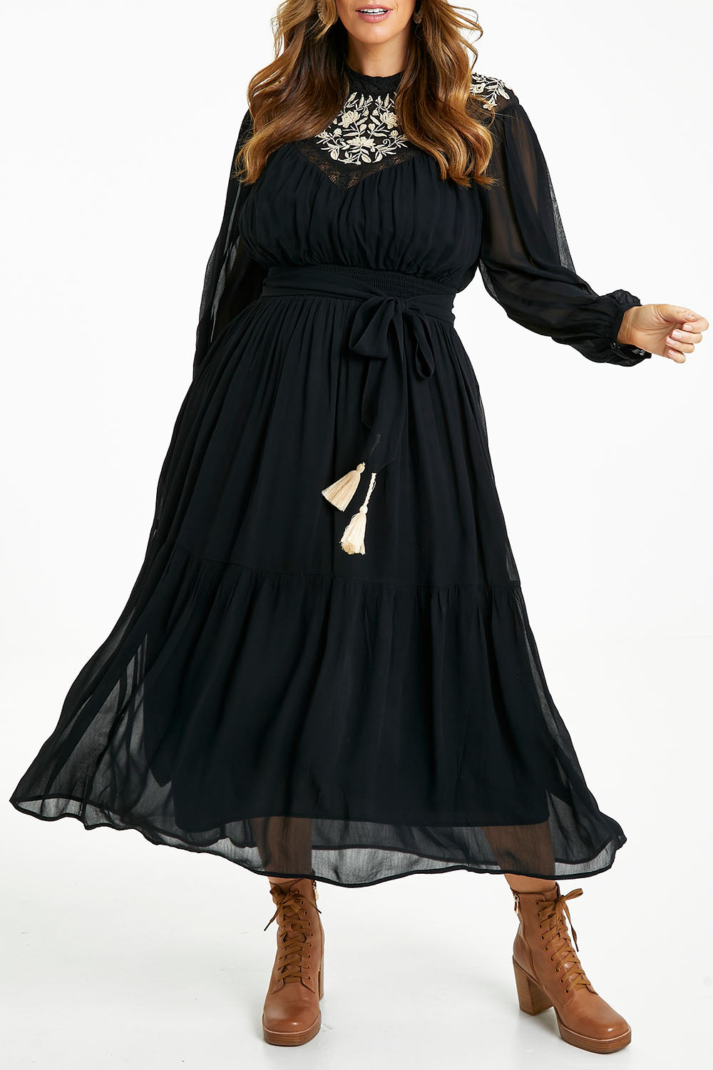Model Laura wearing size 14 of the Good Vibes Embroidered Dress in colour Black (Black), from the front, cropped image