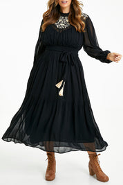 Model Laura wearing size 14 of the Good Vibes Embroidered Dress in colour Black (Black), from the front, cropped image