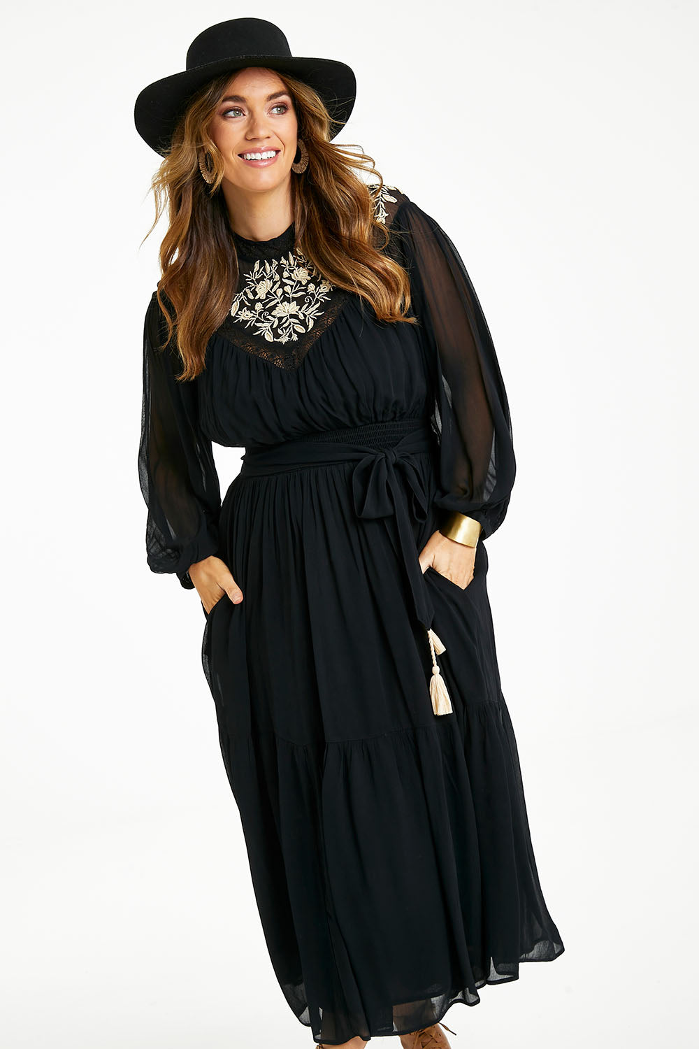 Model Laura wearing size 14 of the Good Vibes Embroidered Dress in colour Black (Black), from the front, cropped image