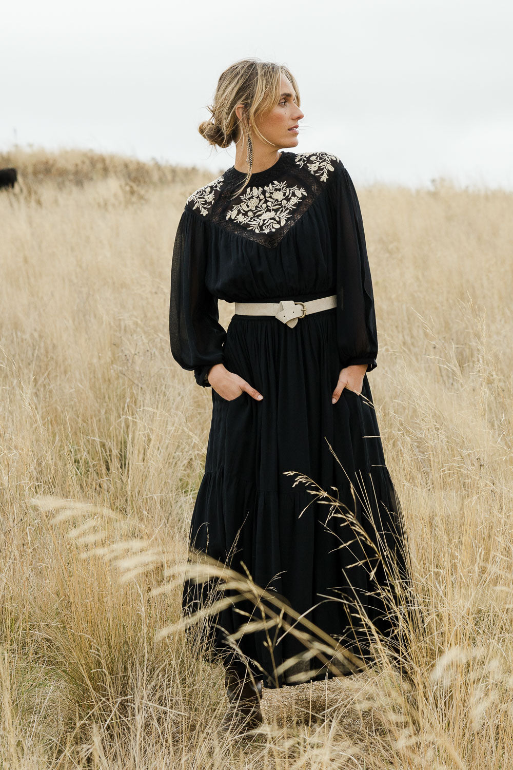 Model Tegan wearing size 10 of the Good Vibes Embroidered Dress in colour Black (Black), from the front, showing the whole outfit