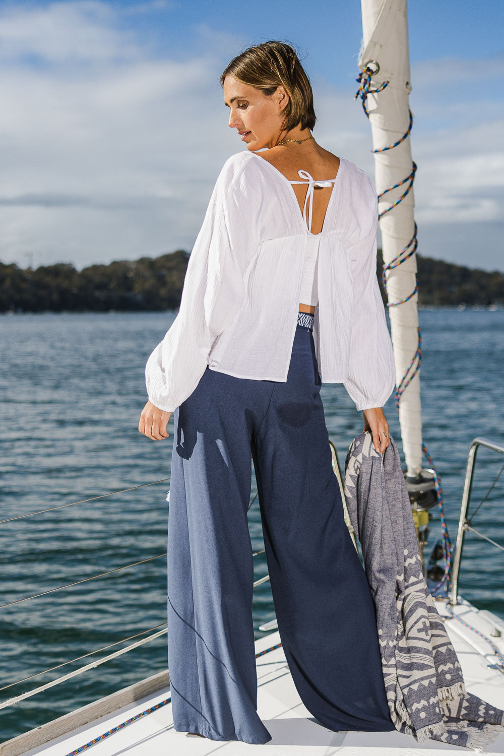 Model Tegan wearing size 10 of the Bringing Sexy Back Blouse in colour White (White), from the front, showing the whole outfit