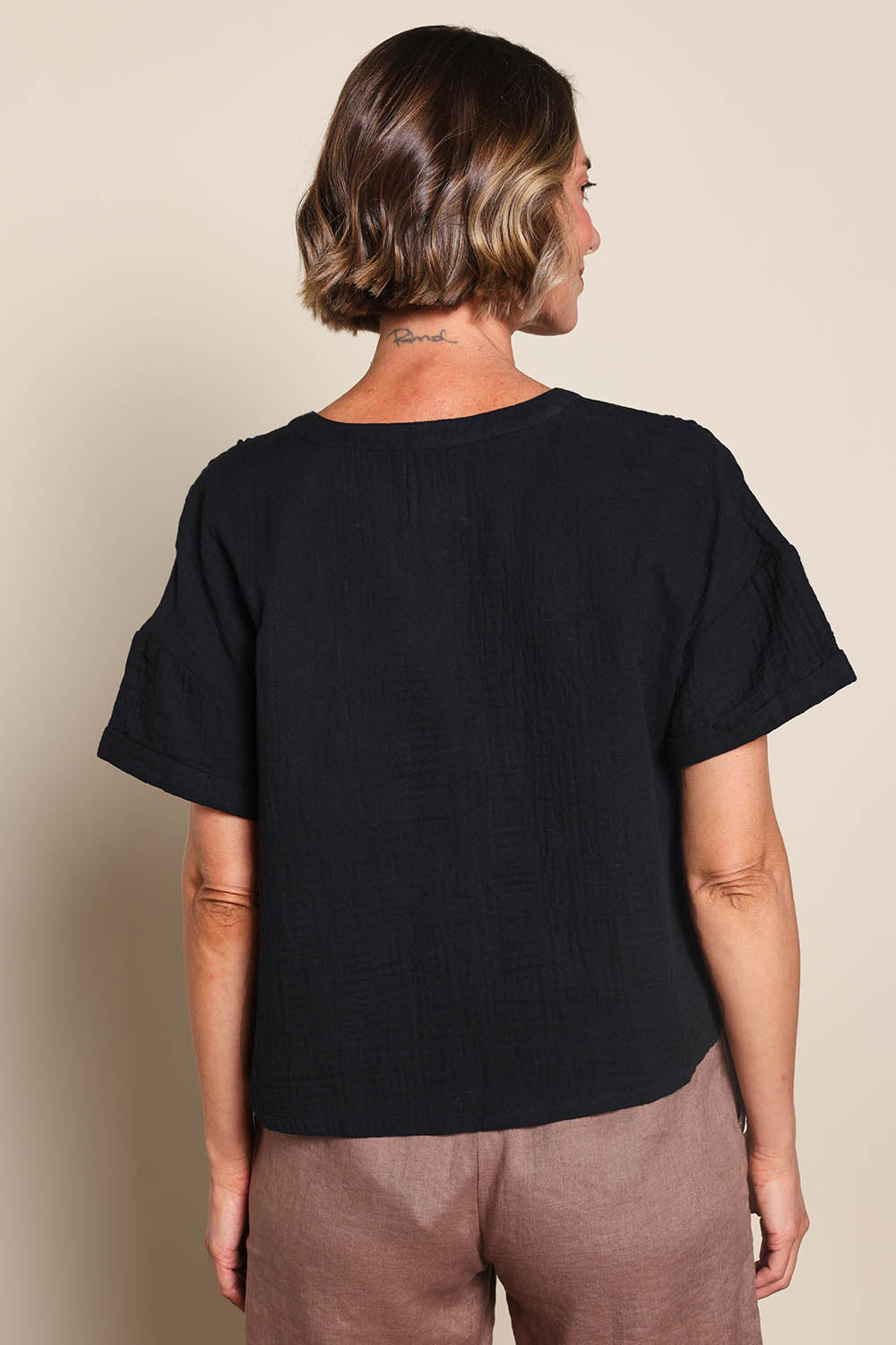 Model Riinar wearing size 10 of the Every Other Day Cotton Blouse – Black in colour Black, from an angle