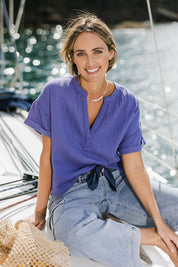 Model Tegan wearing size 10 of the Every Other Day Cotton Blouse in colour Blue (Blue), from the front, showing the whole outfit