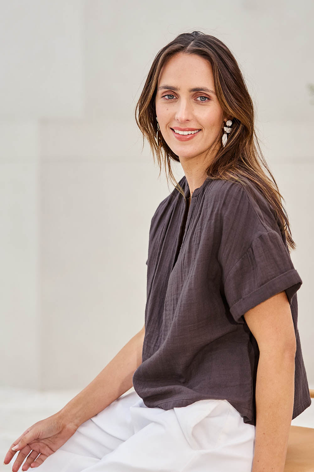 Model Tegand wearing size 10 of the Every Other Day Cotton Blouse – Chocolate in colour Chocolate, from an angle