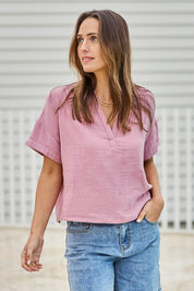 Model Tegand wearing size 10 of the Every Other Day Cotton Blouse – Rose in colour Rose, in a cropped view